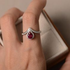 Lab ruby ring pear cut halo ring sterling silver red | Etsy Red Ruby Pear-shaped Rings, Pear-shaped Ruby Rings In Red, Elegant Red Pear-shaped Diamond Ring, Pear-shaped Red Ruby Rings, Formal Teardrop Ruby Ring, Red Pear-shaped Ruby Ring, Red Ruby Diamond Ring In Pear Shape, Red Ruby Diamond Ring Pear-shaped, Fine Jewelry Red Teardrop Ruby Ring