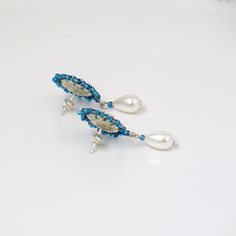 "I created this blue stud earring by hand, using Swarovski 3mm pearls, Miyuki round seed beads, and sterling silver post-with-friction-back Vintage style, feminine and impressive * Measurements: Earrings diameter: 0.59\" (1.5cm) Earrings Length (with drop): 1.33\" (3.4cm) * The earrings will come beautifully packaged for a gift. *Additional information on the matching necklace you can see here: https://www.etsy.com/il-en/listing/231323832/blue-statement-necklace-blue-wedding?ref=related-1 * For Blue Teardrop Pearl Drop Earrings, Blue Dangle Pearl Drop Earrings, Blue Pearl Drop Dangle Earrings, Anniversary Blue Pearl Drop Earrings, Handmade Blue Dangle Pearl Earrings, Handmade Blue Pearl Earrings For Gift, Blue Pearl Drop Earrings For Anniversary, Handmade Blue Drop Bridal Earrings, Handmade Blue Bridal Drop Earrings