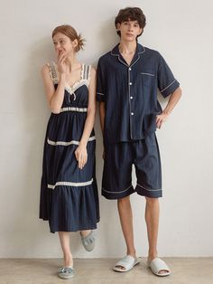 Couple pajamas set in soft cotton fabric. Man's contrast piped trimming short-sleeved shirt with a resort collar, buttons at front, gently dropped shoulders, and an open chest pocket. Shorts with covered elastic at waistband. Woman's nightgown in calf-length, lace-trimmed sweetheart neckline and shoulder straps, and gathered tiers. Unlined.- Couple pajamas- A-line- Midi- Sleeveless Blue Summer Sleepwear For Home, Summer Pajama Party Sleepwear With Pockets, Blue Summer Home Sets, Summer Pajama Shorts With Pockets For Pajama Party, Summer Cotton Nightgown For Loungewear, Summer Nightgown For Pajama Party With Relaxed Fit, Relaxed Fit Summer Nightgown For Pajama Party, Relaxed Fit Nightgown For Summer Loungewear, Summer Loungewear Sets With Pockets