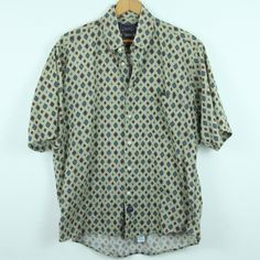 "Vintage 90s 100% cotton button down short sleeve shirt size M. Please check the measurements for size. It is gently used, no holes/stains or tears. Please see all photos for condition. Shoulders 20\" Sleeve 12\" Chest 48\" Length 27\" 132" Patterned Relaxed Fit Short Sleeve Button-up Shirt, Casual Patterned Short Sleeve Button-up Shirt, Patterned Cotton Short Sleeve Button-up Shirt, Patterned Cotton Button-up Short Sleeve Shirt, Patterned Cotton Camp Shirt With Short Sleeves, Retro Cotton Hawaiian Shirt With Short Sleeves, Patterned Short Sleeve Shirt With Buttons, Classic Relaxed Fit Hawaiian Cotton Shirt, Classic Relaxed Fit Cotton Hawaiian Shirt