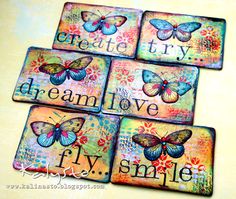 four coasters with butterflies and words on them