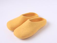 These beautiful slippers are good for both hot and cold weather keeping your feet warm and preventing it from sweating.  - beautiful and minimalistic - breathable and comfortable - nonslip, safe - 100% handmade from natural wool 📐  Available sizes: US 7-12 🎁  Slippers come with a dust/travel storage bag 🕐  Order processing time: 1-2 days 🤚🏼  100% handmade throughout entire process 📦  FREE shipping within USA 🌍  We ship to any part of the world. Shipping fee varies.  These house shoes are hand-made one by one and made from 100% raw wool. We shear the sheep that are carefully raised in Kyrgyzstan's nature, entangle the wool with soap water and fibers, and compress to form a shape. It is safe to wear due to the rubber for anti-slip on the back. Room shoes have no seams so that they are Yellow Slip-on Winter Slippers, Yellow Non-slip Round Toe Slippers, Comfortable Non-slip Yellow Slippers, Yellow Slippers, Comfortable Wool Slip-on Slippers, Wool Indoor Slip-on Slippers, Travel Storage Bag, Wool Slippers, House Shoes