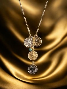 The Pahlavi Coin Necklace is a stunning piece of jewelry that beautifully merges history with elegance. Adorned with four Old Fashion Yek Geroonie coin style pendants, two coin in silver color and two coin in gold color. This necklace is a true representation of the rich cultural heritage of Persia. Each pendant is carefully crafted in 18k gold plating and silver plating, adding a touch of luxury and sophistication to the necklace. The intricate details and design of the coins make it a unique a Elegant Round Medallion Necklace With Charms, Elegant Medallion Coin Necklace For Anniversary, Elegant Silver Coin Necklace For Anniversary, Luxury Gold Coin Necklace, Elegant Coin Pendant Medallion Necklace For Anniversary, Luxury Yellow Gold Coin Medallion Necklace, Elegant Coin Pendant Necklace As Gift, Elegant Medallion Coin Necklace For Gift, Elegant Medallion Necklace With Coin Pendant For Anniversary