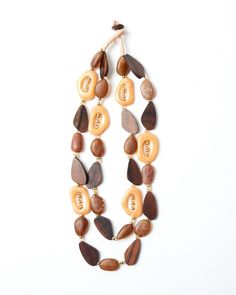 Talk about a statement necklace! Oblong shaped wood beads Clear crystal and plated gold metal beads Button closure Wrapped with full-grain leather Fair Games, Metal Beads, Wood Beads, Clear Crystal, Full Grain Leather, Talk About, Sale Items, Womens Necklaces, Gold Metal