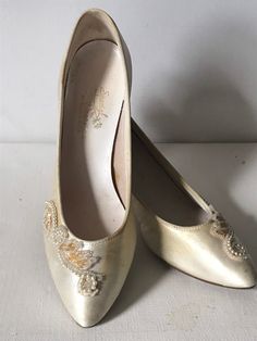 "Very small pair of Ivory satin pumps embellished with seed pearls, sequins and glass seed beads on the top vamp of the shoe. These shoes are very tiny and would probably only fit a child, therefore they be perfect for the little child that plays ' dress up' They belonged to my Aunt who married in 1940. In very good vintage condition as they were only worn on that day. Some yellowing on the ivory satin which is to be expected.  Measurements are; Inner sole toe to heel* 7 3/4\" Ball of foot 2 3/4\" Heel* 2 1/2\" Feel free to convo me with any further questions. Thank you for your interest." Vintage Low Heel Wedding Shoes For Party, Vintage Round Toe Wedding Shoes For Party, Vintage White Heels For Wedding, Vintage Heels With Pointed Toe For Wedding, Vintage Pointed Toe Heels For Wedding, Vintage Round Toe Heels For Wedding, Vintage Wedding Heels With Pointed Toe, Vintage Wedding Heels With Round Toe, Vintage High Heel Wedding Shoes For Formal Occasions