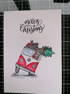 a christmas card with an image of a vw bus and presents on the roof