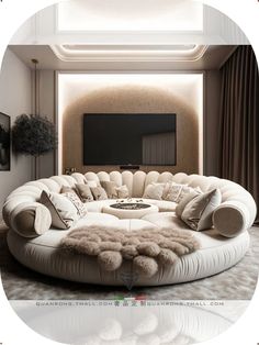 a living room filled with furniture and a large round couch in front of a flat screen tv