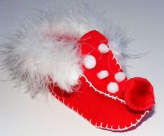 a red shoe with white fur on it