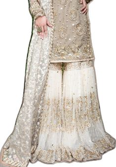 Pakistani designer embroidered white gharara dress White Chinon Dress With Intricate Embroidery, White Sharara With Intricate Embroidery For Party Wear, White Party Dress With Intricate Embroidery, White Chinon Designer Dresses, White Chinon Palazzo Set With Dabka Work, White Floor-length Palazzo Set With Dabka Work, White Sharara With Dabka Work For Reception, White Floor-length Chinon Dress, White Sharara For Eid Party Wear