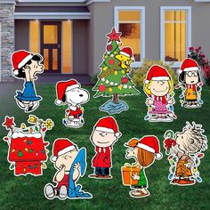 a group of cartoon characters standing in front of a house next to a christmas tree