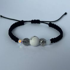 The Macrame Bracelet is simple and elegant and can be worn everyday. It is made of 1mm nylon cord, 2 pieces of 5mm crystal beads, 2 pieces of 6mm crystal beads and 1 piece of 10mm howlite. The bracelet is adjustable to fit your wrist and is easy to put on with the slide lock. To change the size, you just need to pull the ends of the bracelet. It is approx. 14cm long and each adjustment unit is approx. 6cm long. A beautiful handmade macrame bracelet is a perfect gift for your loved ones or for yo Adjustable Crystal Bracelet With Round Beads For Everyday, Adjustable Spiritual Crystal Bracelet For Everyday Wear, Handmade Adjustable Crystal Bracelet In Minimalist Style, Handmade Adjustable Minimalist Crystal Bracelet, Adjustable Minimalist Hand-strung Friendship Bracelets, Minimalist Adjustable Hand-strung Friendship Bracelets, Handmade Adjustable White Crystal Bracelet, White Friendship Bracelets With Round Beads And Adjustable Cord, Adjustable Minimalist Crystal Bracelet