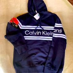 Nwt Calvin Klein Logo Hoodie. Drawstring Hood, Ribbed Cuffs. Stretch Ribbed Waist Band. Signature Calvin Klein Logo Across Chest And Long Sleeves. Large Kangaroo Style Pouch. Calvin Klein Crew Neck Sweatshirt With Ribbed Cuffs, Calvin Klein Sporty Sweatshirt With Ribbed Cuffs, Calvin Klein Sweatshirt With Ribbed Cuffs For Streetwear, Calvin Klein Winter Sweatshirt With Ribbed Cuffs, Calvin Klein Hoodie With Drawstring Hood For Winter, Calvin Klein Winter Hoodie With Drawstring Hood, Calvin Klein Cotton Sweatshirt For Spring, Calvin Klein Sporty Hoodie For Streetwear, Calvin Klein Hoodie Sweatshirt For Fall