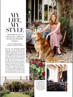 a woman sitting on a bench next to a brown dog in front of a house