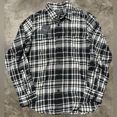 Brand New With Tags Classic Shirt With Buttons For Streetwear, Urban Black Button-up Top, Casual Black Shirt With Snap Buttons, Black Winter Flannel Shirt With Button Closure, Black Cotton Relaxed Fit Flannel Shirt, Classic Black Flannel Shirt, Black Collared Flannel Shirt With Buttons, Black Cotton Shirt With Button Closure, Black Relaxed Fit Flannel Shirt