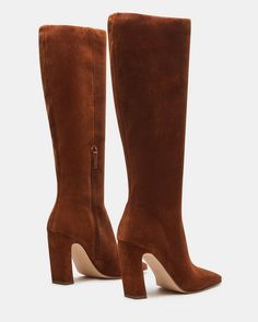 Expertly constructed, the LIZETTE boot is designed with a sleek knee-high silhouette, square toe, and stylish heel. This boot is durable and fashionable, making it the perfect addition to any wardrobe. Elevate your look with these timeless boots. 3.5 inch heel height Size 6 measurements: 14.5 inch shaft circumference, 14 inch shaft height Size 8 measurements: 16 inch shaft circumference, 14.5 inch shaft height Size 10 measurements: 16.75 inch shaft circumference, 15 inch shaft height Textile and Classic Square Toe Knee-high Boots For Fall, Classic Tall Heeled Boots For Fall, Chic Tall Brown Heeled Boots, Classic Knee-high Heeled Boots For Fall, Tall Heeled Boots For Formal Fall Occasions, Tall Heeled Boots For Fall Formal Events, Formal Knee-high Boots For Fall, Formal Fall Knee-high Boots, Brown Tall Heeled Boots Medium Width