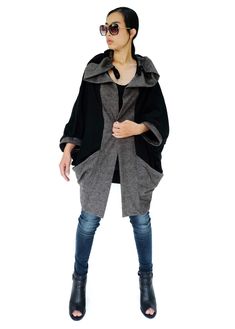 "* ALL ORDERS ARE SHIPPED VIA DHL EXPEDITED MAIL * A very modern, oversized jacket that has a balloon-shaped with mottled gray front panels, sleeves cuffed and pockets. A wonderful and generous collar with drawstrings to create the silhouette you want. No button -- but it can be closed or draped with a brooch. DETAILS: * Shawl collar * Short batwing sleeves with cuffed * Front pockets * Unlined * No button MEASUREMENTS: Bust: 48\" (122 cm) Sleeve length (from side of neckline): 21\" (53 cm) Hips Modern Black Cardigan For Winter, Chic Batwing Sleeve Fall Outerwear, Chic Fall Outerwear With Batwing Sleeve, Trendy Batwing Sleeve Fall Outerwear, Trendy Oversized Outerwear With Batwing Sleeves, Fall Trendy Outerwear With Batwing Sleeves, Chic Winter Outerwear With Batwing Sleeve, Trendy Fall Outerwear With Batwing Sleeves, Oversized Batwing Sleeve Outerwear For Fall