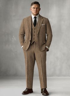 The Irish Brown Herringbone Tweed Suit will become the standard of business dressing and by far the most ubiquitous option. Crafted from wool, the Irish Brown color of the suit will surely influence a veteran dresser to buy the suit for building a sharp wardrobe. Team it up with a matching waistcoat, a white shirt and dark brown derby shoes.  Look Includes  Irish Brown Herringbone Tweed Fabric  Two Button Jacket Style  Notch Lapel  Horn Brown Buttons  Single Vent  Three Cuff Buttons  Two Welted Back Pockets on Trousers    Click 'Customize Now' to modify the look if needed.   Lining: Viscose, Dry Clean. Formal Tailored Tweed Sport Coat, Tailored Tweed Sport Coat For Formal Occasions, Business Tweed Jacket With Herringbone Pattern, Classic Tweed Suit For Business Casual, Formal Tweed Jacket With Herringbone Pattern, Classic Tweed Business Casual Suit, Semi-formal Herringbone Tweed Jacket, Timeless Tweed Jacket With Herringbone Pattern For Business, Timeless Business Tweed Jacket With Herringbone Pattern