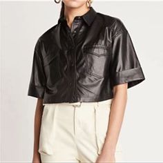 Vegan Leather And A Cropped Silhouette Give This Button-Down A Serious Street Style Edge. Tonal Hardware. Patch Pockets With Flaps And Rolled Sleeves. True To Size. Fabric: 65% Polyurethane 35% Rayon Cropped Fall Shirt With Button Closure, Casual Shirt With Button Closure For Night Out, Snap Button Tops For Night Out In Fall, Edgy Spring Tops With Buttons, Snap Button Tops For Night Out, Edgy Button-up Top For Spring, Chic Short Sleeve Shirt For Night Out, Spring Night Out Top With Snap Buttons, Chic Cropped Shirt With Button Closure