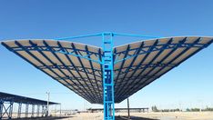 a large metal structure sitting on top of a train track