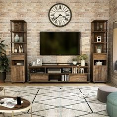 a living room with a large clock mounted to the wall above it's entertainment center