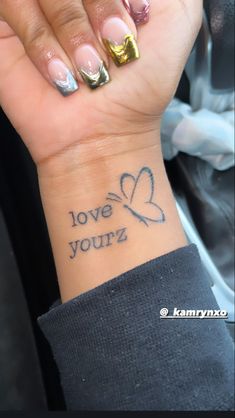 Love yourz tattoo on wrist dainty minimalistic butterfly j Cole song positive quote Butterfly On Wrist, Tattoo With Butterfly, Small Girly Tattoos, Pretty Hand Tattoos, Tattoo Wrist, Tattoo Butterfly, Strange World