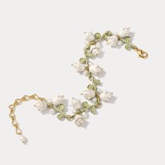 Experience the timeless elegance of the Lily of the Valley Bracelet. Crafted from 18k gold, this exquisite piece is perfect for adding a touch of sophistication and luxury to any look. Leave your mark with an accessory that you won't find anywhere else. DETAILS Plating: 18K Gold Materials: 18K Gold on Brass, Freshwater Leave Your Mark, Diamond Star Necklace, Star And Moon Necklace, Lily Of The Valley Flowers, Rabbit Earrings, Diamond Evil Eye, Lucky Bracelet, Evil Eye Earrings, Wedding Party Jewelry