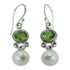 The milky luminescence of pearl basks in the verdant light of peridot. Set in sterling silver the gemstones total 12.5 carats in earrings by India's Shanker. .925 Sterling silver Classic Green Peridot Earrings, Classic Green Pearl Drop Jewelry, Elegant Peridot Jewelry For May Birthstone, Elegant Lime Green Sterling Silver Jewelry, Elegant Lime Green Jewelry For May Birthstone, Elegant Lime Green Dangle Earrings, Elegant Lime Green Earrings For Formal Occasions, Elegant Lime Green Earrings For Formal Events, Elegant Green Pearl Earrings For May Birthstone