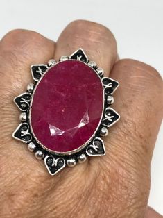 Unusual deep toned raw Ruby low content silver setting handmade size 8 Can be resized. My jeweler charges a $10- $20 fee All rings are shipped in a nice gift box. Check out our over a THOUSAND great reviews Engraving is $4 per letter and is not always perfect depending on the piece. It can take a few days if the jeweler is busy. This is payable to Paypal Judithsltd@gmail.com Handmade Oval Ruby Ring Gift, Artisan Ring With Large Stone For Gift, Unique Handmade Oval Ruby Ring, Unique Handmade Ruby Ring Gift, Unique Handmade Ruby Ring As Gift, Handmade Spiritual Ruby Ring As Gift, Handmade Spiritual Ruby Ring For Anniversary, Handmade Spiritual Ruby Ring For Gift, Handmade Sterling Silver Ruby Ring As Gift