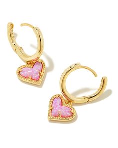 Hearts and huggies together—is there anything better? The Ari Heart Gold Huggie Earrings in Bubblegum Pink Kyocera Opal adds that little something extra to your look with its playful asymmetrical design. Metal 14k Gold Over Brass Material Bubblegum Pink Kyocera Opal Closure Ear Post Size 0.6" outside diameter, 0.33"L X 0.28"W charmDue to the one-of-a-kind nature of the medium, exact colors and patterns may vary slightly from the image shown. | Kendra Scott Ari Heart Gold Huggie Earrings in Bubbl 16th Wishlist, Jewelry Queen, Preppy Accessories, Gold Huggie Earrings, Huggie Earrings Gold, Jewelry Girl, Preppy Jewelry, Kendra Scott Necklace, Kendra Scott Earrings