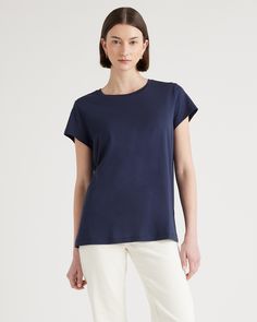 Upgrade your wardrobe basics with our Cotton Modal Crewneck Swing Tee. This super soft and stretchy cotton blend is wrinkle-resistant with a flattering, smooth finish. It's easygoing for everyday wear, and has comfy wearability to pair with any outfit. Basic Everyday Modal Tops, Basic Modal Tops For Everyday, Basic Modal Tops For Everyday Wear, Solid Color Pima Cotton Tops For Everyday, Solid Pima Cotton Tops For Everyday, Everyday Solid Pima Cotton Tops, Everyday Solid Color Modal Tops, Classic Cotton Tops With Shirttail Hem, Relaxed Fit Modal T-shirt