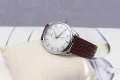 This is a men's vintage from 1956 Omega mechanical hand winding watch. It works and keeps time well, The movement has been serviced. Cams with the free gift box; https://www.etsy.com/listing/810262694/gift-box?ref=shop_home_active_1&frs=1 Condition: very good Case: stainless steel; polished; lug to lug 43mm; width without crown 35mm Case back: stainless steel Crystal: acrylic; new; free of any scratches Dial: two tone; restored Crown: Omega Band: new; hand made; dark brown genuine leather; w Retro Chronometer Watch Accessories For Business, Vintage White Watch Accessories With Round Dial, Vintage White Round Dial Watch Accessories, Vintage White Automatic Watch Accessories, Retro White Watches For Formal Occasions, White Retro Watch For Formal Occasions, White Retro Formal Watch, White Retro Formal Watches, Retro Brown Watch Accessories For Formal Occasion