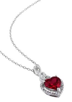 For a sparkling touch of romance, this Created Ruby and Diamond Pendant is the perfect choice. A single heart-shaped created ruby (8mm x 8mm) is prong set amid frames of fiery round, prong-set diamond accents (G-H, I2-I3), while round diamonds twinkle along the swirled suspension bail, for a total of 15 diamond accents in all. The pendant is crafted in lustrous sterling silver and is secured with a spring ring closure. | Belk & Co Lab Created Diamond and Created Ruby Heart Twist Pendant with Cha Elegant Ruby Heart Cut Jewelry, Elegant Red Heart Necklace With Birthstone, Elegant Heart Cut Ruby Jewelry, Elegant Gemstone Heart Necklace For Anniversary, Elegant Red Heart Birthstone Necklace, Ruby Heart Pendant Jewelry For Anniversary, Elegant Red Heart Pendant Jewelry, Heart-shaped Ruby Jewelry With Prong Setting, Heart Shaped Ruby Jewelry With Prong Setting