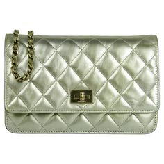 Chanel Metallic Gold Leather Quilted Reissue Wallet On Chain WOC Crossbody Bag. Chain can be tucked inside bag to also be worn as a clutch. Interior features green gold color detail.  Made In: Italy Year of Production: 2016-2017 Color: Gold Hardware: Goldtone Materials: Calfskin leather Lining: Leather and grosgrain Closure/Opening: Flap top with twistlock closure Exterior Pockets: Back patch pocket Interior Pockets:  Zipper under flap, slit at pocket, zipper pocket, six credit card slots Exterior Condition: Very good/excellent. Light wear to corners- see photos Interior Condition: Excellent Includes: Chanel box, dustbag, authenticity card Measurements: 7.5"L x 5H x 1.5"D Strap Drop: 24" Card Measurements, Chanel Box, Inside Bag, Wallet On Chain, Bag Chain, Gold Leather, Green Gold, Metallic Gold, Fashion Handbags