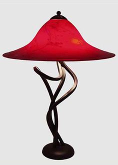 a lamp with a red shade on it