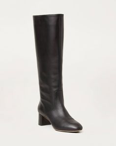 Tall shaft boot with mid-heel in black soft calf leather. Padded footbed with gold stamped logo. Almond toe, pulls on. 2 inch heel. Classic Formal Mid-calf Boots With Block Heel, Classic Low-heeled Boots With Sculpted Heel, Classic Boots With Sculpted Low Heel, Classic Low Heel Boots With Sculpted Heel, Classic Wide Calf Low Heel Boots, Classic Wide Calf Heeled Boots With Low Heel, Low Heel Boots With Sculpted Heel For Work, Formal Mid-calf Boots With Reinforced Low Heel, Classic Wide Calf Boots With Low Heel