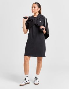 Switch up your off-duty look with this women's 3-Stripes Badge of Sport Dress from adidas. Made from soft cotton jersey fabric for a comfy feel, this loose-fitting dress has a crew neckline and short sleeves. It lands in a Black colourway and is finished up with White 3-Stripes to the shoulders and the Badge of Sport logo to the chest. Machine washable. | Our model is 5'6" and wears a size small. | HR4923 Chest Machine, Sport Logo, Cotton Jersey Fabric, Fitting Dress, Loose Fitting Dresses, Sport Dress, Boyfriend Tee, Grey Adidas, Jd Sports