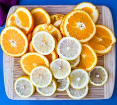 sliced oranges are arranged on a cutting board