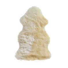 a white sheepskin rug is shown against a white background, with the top part of it's fur visible