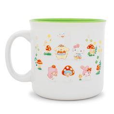 a white coffee mug with cartoon animals and mushrooms painted on it's side, sitting in front of a white background