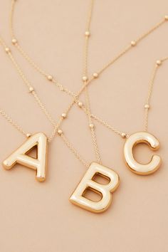 The 18K Gold Monogram Necklace gives any outfit a personal touch! With a dainty chain and initial, this will become your go-to accessory! The perfect layering piece, this necklace makes the perfect gift for friends and family. Gold Initial Pendant Jewelry With Letter Beads, Delicate Chain Initial Pendant Necklace, Gold Initial Pendant Charm Necklace With Initials, Gold Monogram Initial Pendant Necklace, Everyday Initial Pendant Necklace, Gold Name Necklace With Initial Pendant And Delicate Chain, Personalized Gold Initial Pendant Necklace, Minimalist Initial Necklace With Letter Beads, Personalized Gift Initial Necklace With Letter Beads