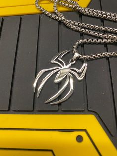 Spiderman Logo Pendant Made in metal alloy and polished. A chain is included Kindly note, due to their handmade nature, there may be minor imperfections on each piece. Ships from Singapore via registered post. You will be provided with the tracking number. Please check out our other listings with lots of cool swag. https://www.etsy.com/sg-en/shop/RancorRider?ref=seller-platform-mcnav Our Shipping policy. We will provide you with the tracking number once the item has been dispatched. Kindly be pa Masc Accessories, Spiderman Earrings, Spiderman Jewelry, Spiderman Necklace, Spiderman Accessories, Spiderman Stuff, Spider Logo, Spiderman Gifts, Spiderman Logo