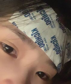 a close up of a person wearing a bandana