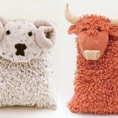 two knitted animals sitting next to each other