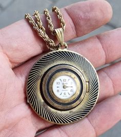 Vintage German 1960 LUWA Mechanical Women's Necklace Pendant Watch  Rarer watch  Watch in working order - RUNS  MECHANICAL - manual winding  Caliber : E. B. Felsa / F 800 Ca. 1960 Case diameter 40 mm Watch dial 17 mm Chain not very long , length 44 cm or 17.3" On back * M. Gesch. IV / MR 2031. L * Vintage watch w signs of wear  PLEASE NOTE Vintage Jewelry & Watches : Please be aware that vintage jewelry / watches often has some signs of use upon close examination, as well as some patina on sterl Pendant Watch, Women's Necklace, Watch Dial, Full Picture, Pendant Watches, Watch Necklace, Vintage Watches, Long Length, Necklace Pendant