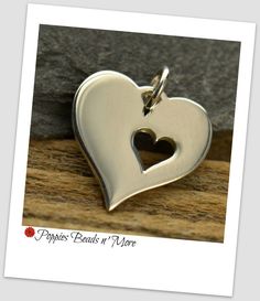 Sterling Silver Large Heart with Cutout Heart. An adorable gift for a mother, best friends, or someone wanting to express their feelings for a loved one Measurements: 18mm x 14.5mmx 1mm The purchase of this listing includes one (1) Sterling Silver Large Heart with Cutout Heart. If you would like additional heart charms, please select the quantity you need using the drop down menu to the right of this description during the checkout process. If you would like to continue shopping for more jewelry Valentine's Day Best Friend Gift Heart Necklace, Heart Charm Necklace For Best Friend, Heart Necklace For Everyday Valentine's Day, Valentine's Day Heart Pendant Necklace For Best Friend, Valentine's Day Everyday Heart Necklace, Double Heart Necklace For Everyday And Mother's Day, Heart Shaped Necklace For Mother's Day, Heart Charm Necklace For Mother's Day Anniversary, Double Heart Necklace With Heart Charm For Mother's Day