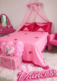 a pink bedroom with princess decorations and accessories