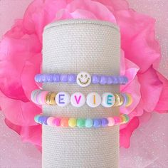 CHARLESTON CHARMED's Pretty Pastels Sweetheart Heishi Beaded Bracelets are so pretty and chic. Wear one as a statement piece or create a beautiful, original, custom stack! These also make perfect gifts for moms, grandmas, sisters, brides to be, bridesmaids, flower girls, baby shower, graduations, birthdays, bachelorette party, best friends, teachers... the list is endless. PRODUCT DETAILS ♥ All letters are upper case an are used with Rainbow letter beads ♥ All Heishi Bracelets come beautifully p Playful Heart-shaped Letter Beads Bracelet, Beaded Bracelets With Heart Beads For Birthday, Heart Beaded Bracelets For Birthdays, Birthday Beaded Bracelets With Heart Beads, Customizable Cute Beaded Bracelets For Birthday, Heart-shaped Letter Beads Bracelet For Birthday, Cute Heart-shaped Bracelets With Letter Beads, Cute Purple Beaded Bracelets For Birthday, Cute Heart-shaped Bracelet With Letter Beads