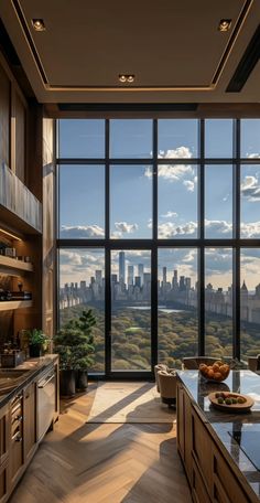 the kitchen is very large and has many windows to look out on the cityscape