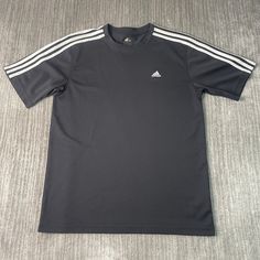 Vintage 2000s Adidas Three Stripes Soccer Casual Sportswear Athletic Y2K Aesthetic Streetwear Black Graphic Jersey Large Mens Condition:  Excellent Used Condition  = No Flaws Measurements: Please see photos above for all measurements IF YOU BUY TWO OR MORE ITEMS USE THE CODE BUNDLE @ CHECK TO SAVE 20% WE SHIP WITHIN 24 HOURS AFTER PURCHASE! Please be aware that we do not offer free returns!! The Buyer is responsible for the cost of the return label. Follow us on TikTok & Instagram @findsnostalgi Black Adidas Logo T-shirt For Sports Season, Sporty T-shirt With Three Stripes For Sports, Black Sporty T-shirt With Athletic Fit, Black Athleisure T-shirt For Sports, Gray Sporty T-shirt For Sports, Black Training T-shirt With Logo Print, Three Stripes Crew Neck Activewear For Sports Season, Black Three Stripes Tops For Sports Events, Sportswear Tops With Three Stripes For Sports