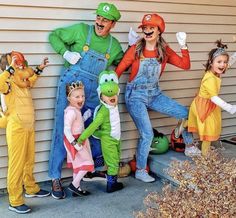 a group of people in costumes standing next to each other